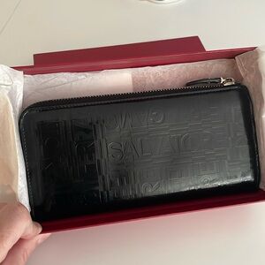 Like New FERRAGAMO - black wallet with zip and name printed on outside, w/ box